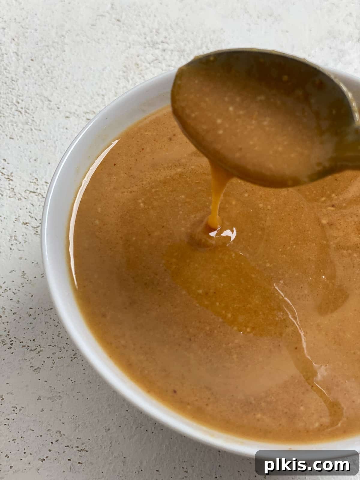 Decadent Salted Caramel Overnight Oats 11 process shot of mixing caramel ingredients for Salted Caramel Overnight Oats in a bowl