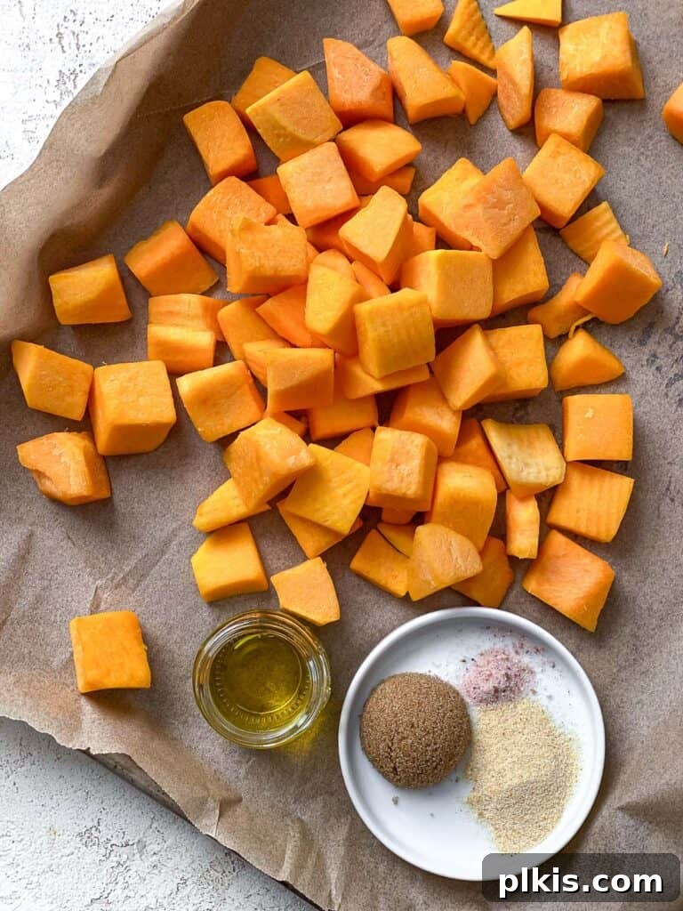 Roasted Pumpkin Harvest Salad 4 process shot of cubed pumpkin in a baking dish