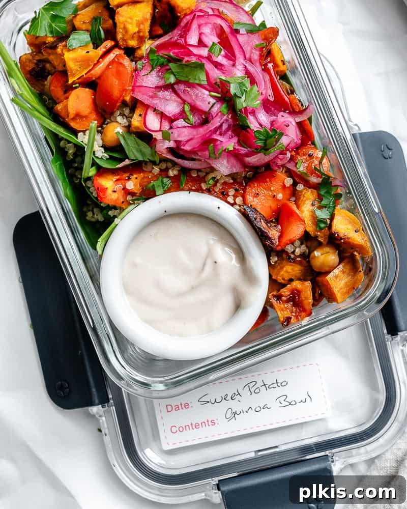 Roasted Sweet Potato Quinoa Power Bowl 20 A perfectly prepared Sweet Potato Quinoa Bowl neatly packed into a clear storage container, ready for meal prep.