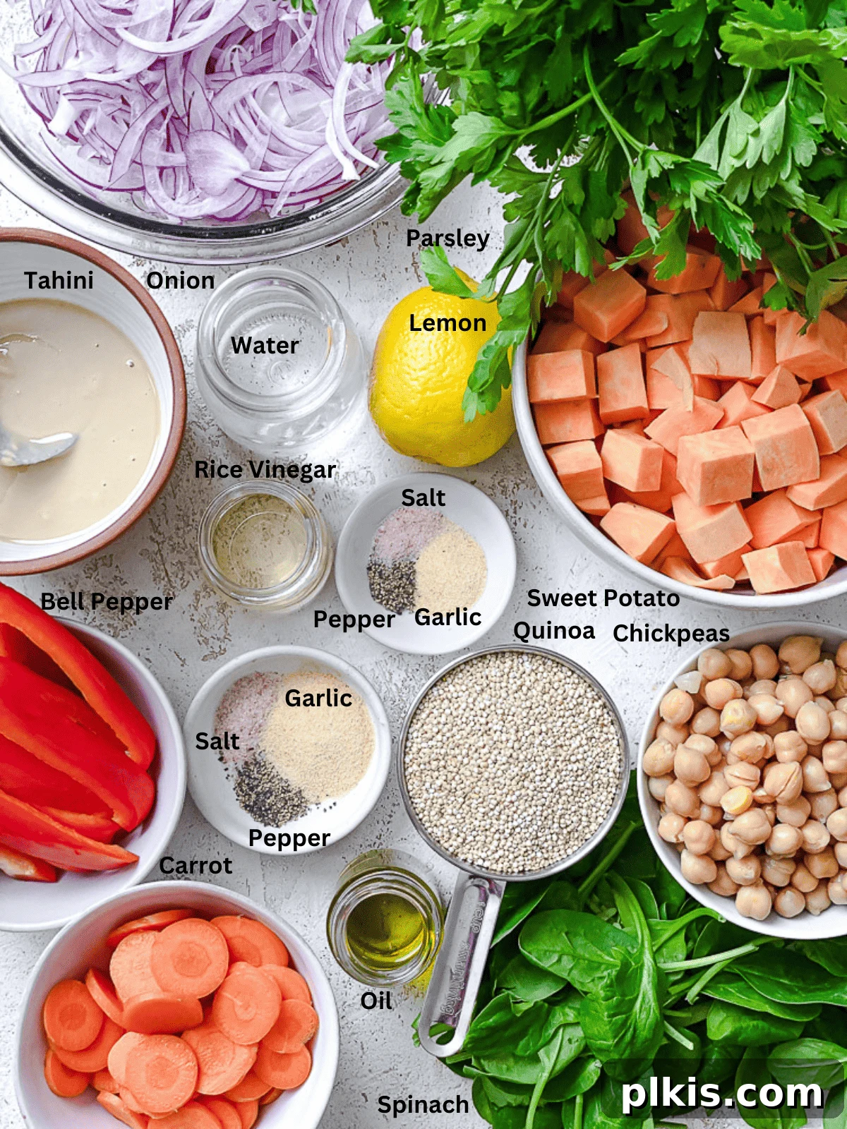 Roasted Sweet Potato Quinoa Power Bowl 3 A collection of fresh, vibrant ingredients for Sweet Potato Quinoa Bowl, neatly arranged on a white surface, ready for preparation.