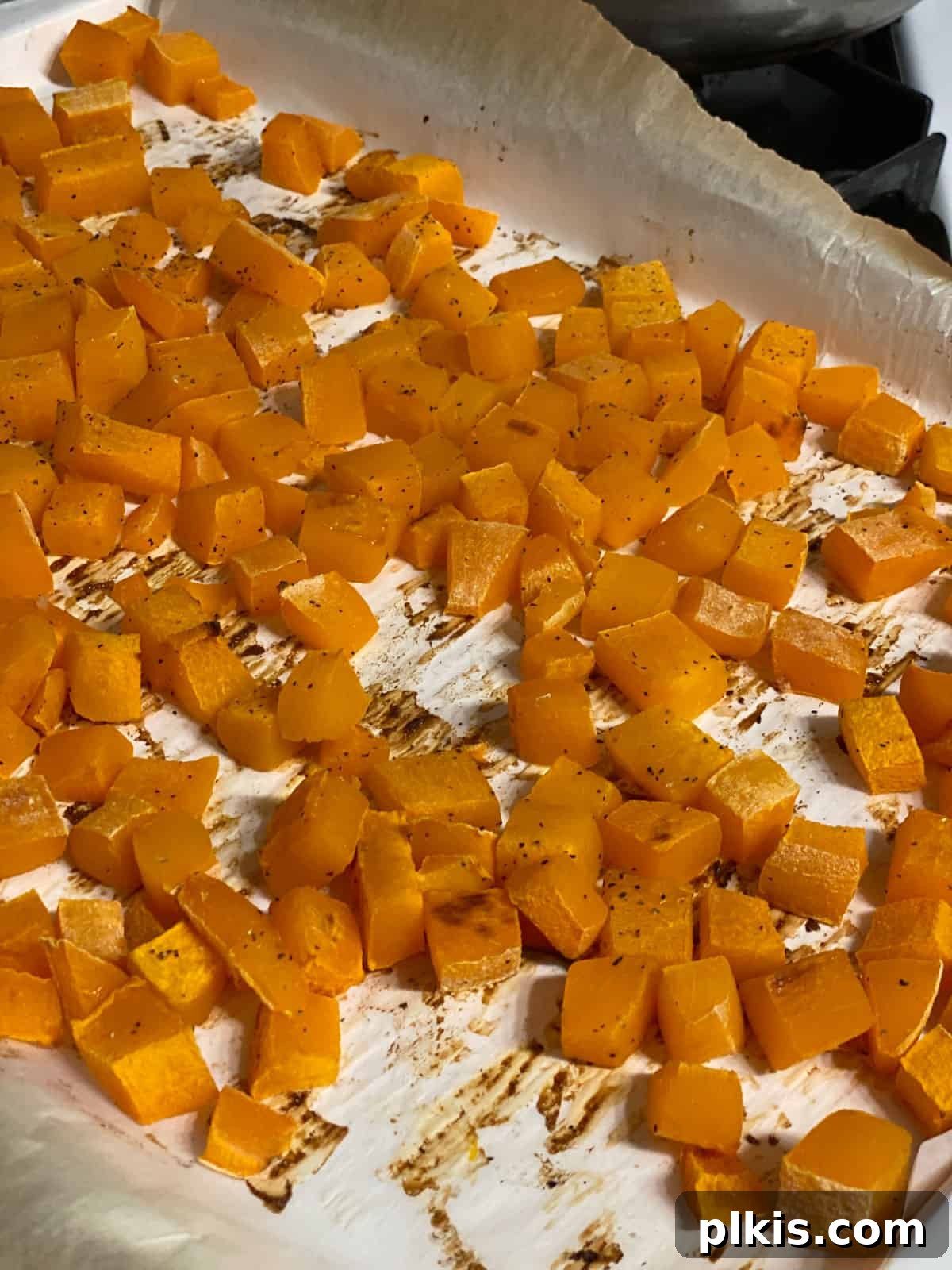 Creamy Vegan Pumpkin Dream 6 post baked pumpkin in a baking tray, tender and slightly browned