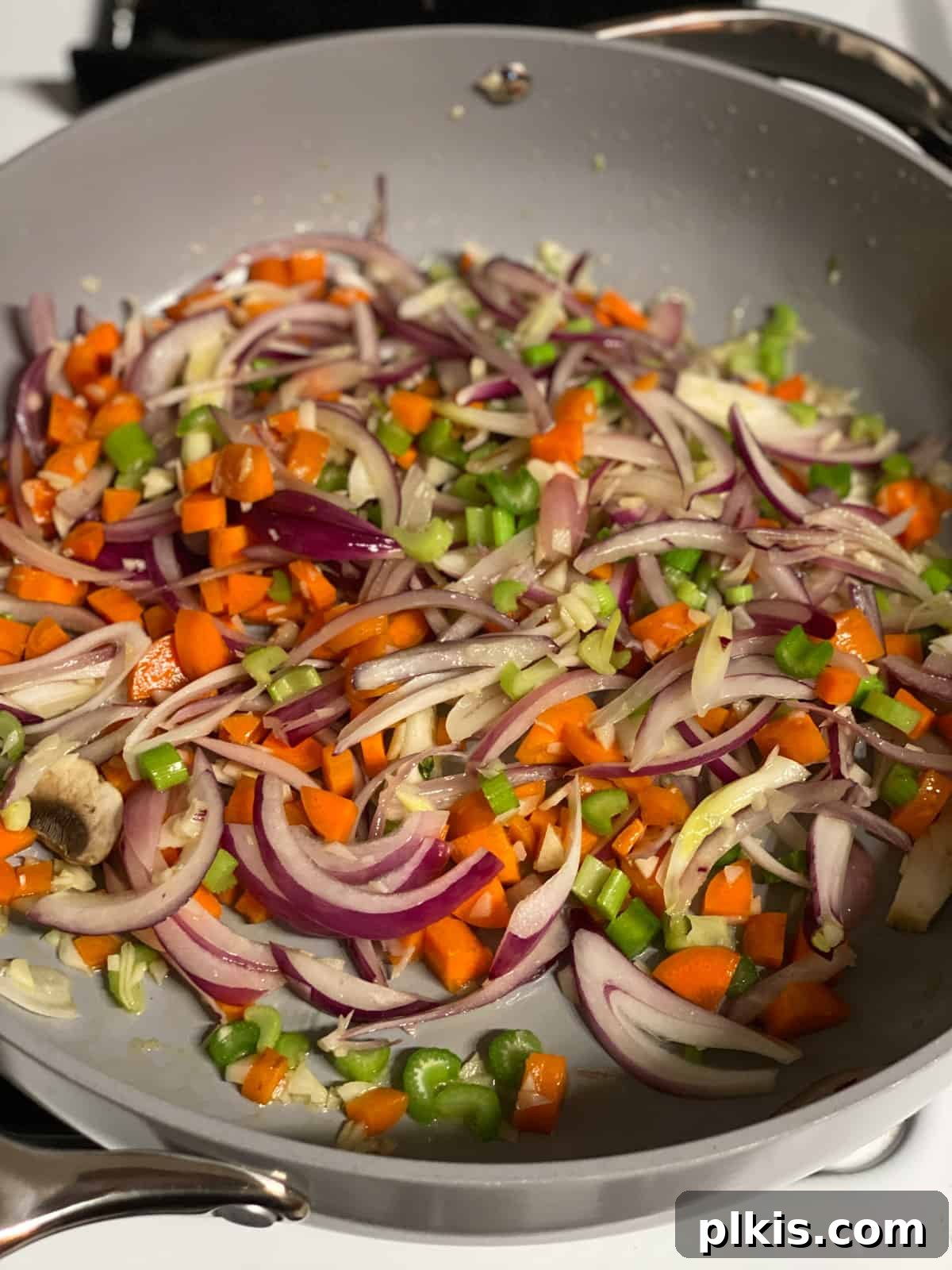 Simple & Savory Mushroom Stuffing 6 process of cooking veggies in a pan