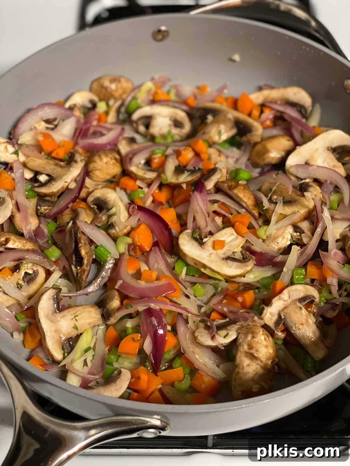 Simple & Savory Mushroom Stuffing 9 process of cooking veggies in a pan