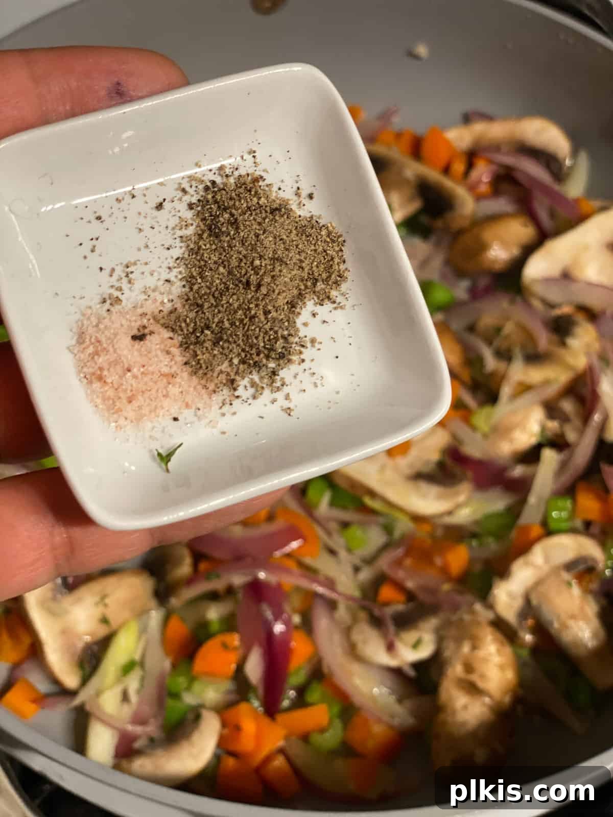 Simple & Savory Mushroom Stuffing 10 process of adding spices to pan