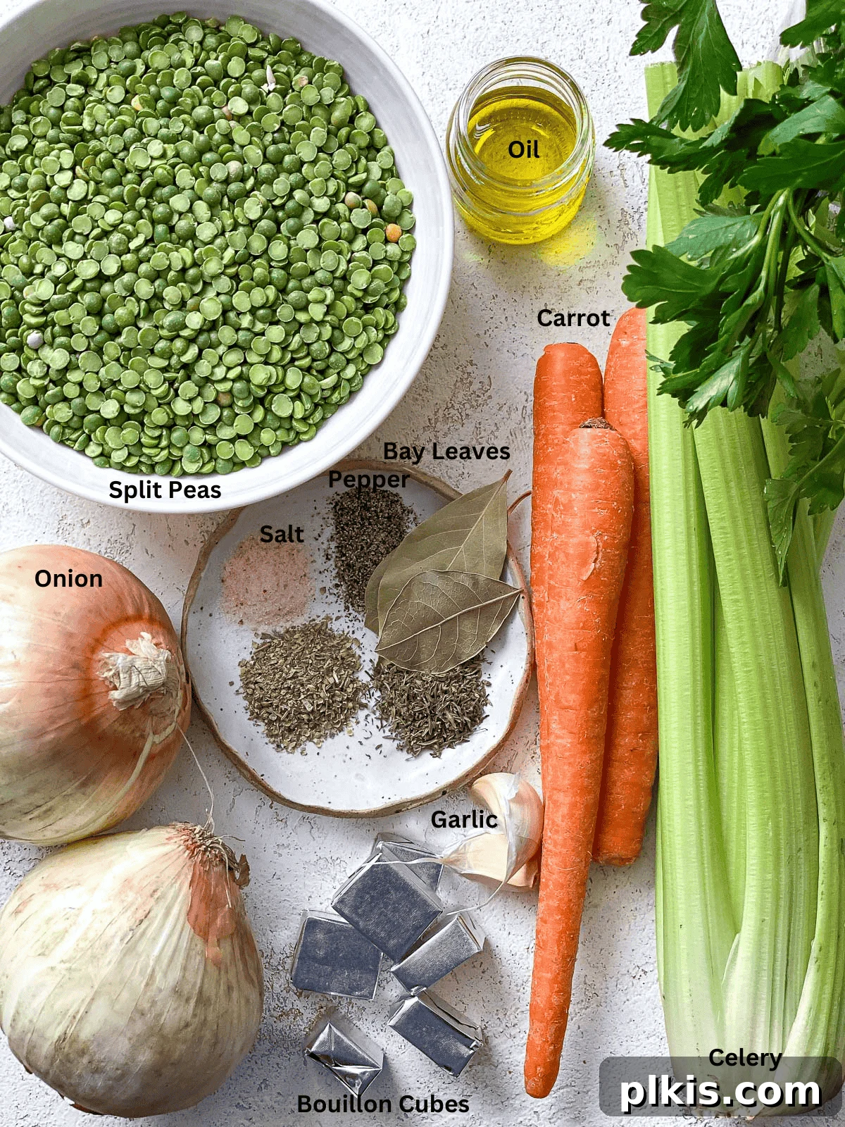 Golden Vegan Split Pea Goodness 3 A collection of fresh, measured ingredients including split peas, diced onion, minced garlic, carrots, celery, and vegetable broth, neatly arranged on a white surface.
