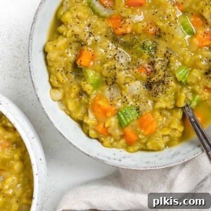 Golden Vegan Split Pea Goodness 8 completed Vegan Split Pea Soup in a white bowl against a white surface