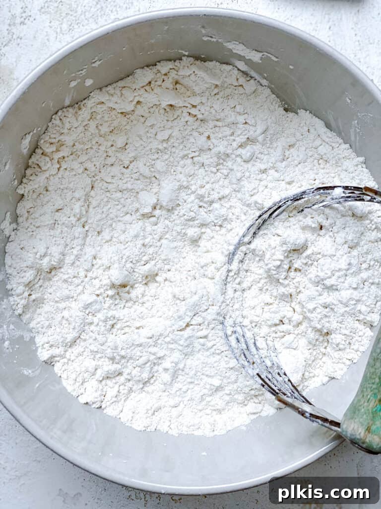 Effortless Plant-Based Biscuits in Minutes 8 The flour and vegan butter mixture has been combined to form coarse, crumbly texture, ready for liquid.