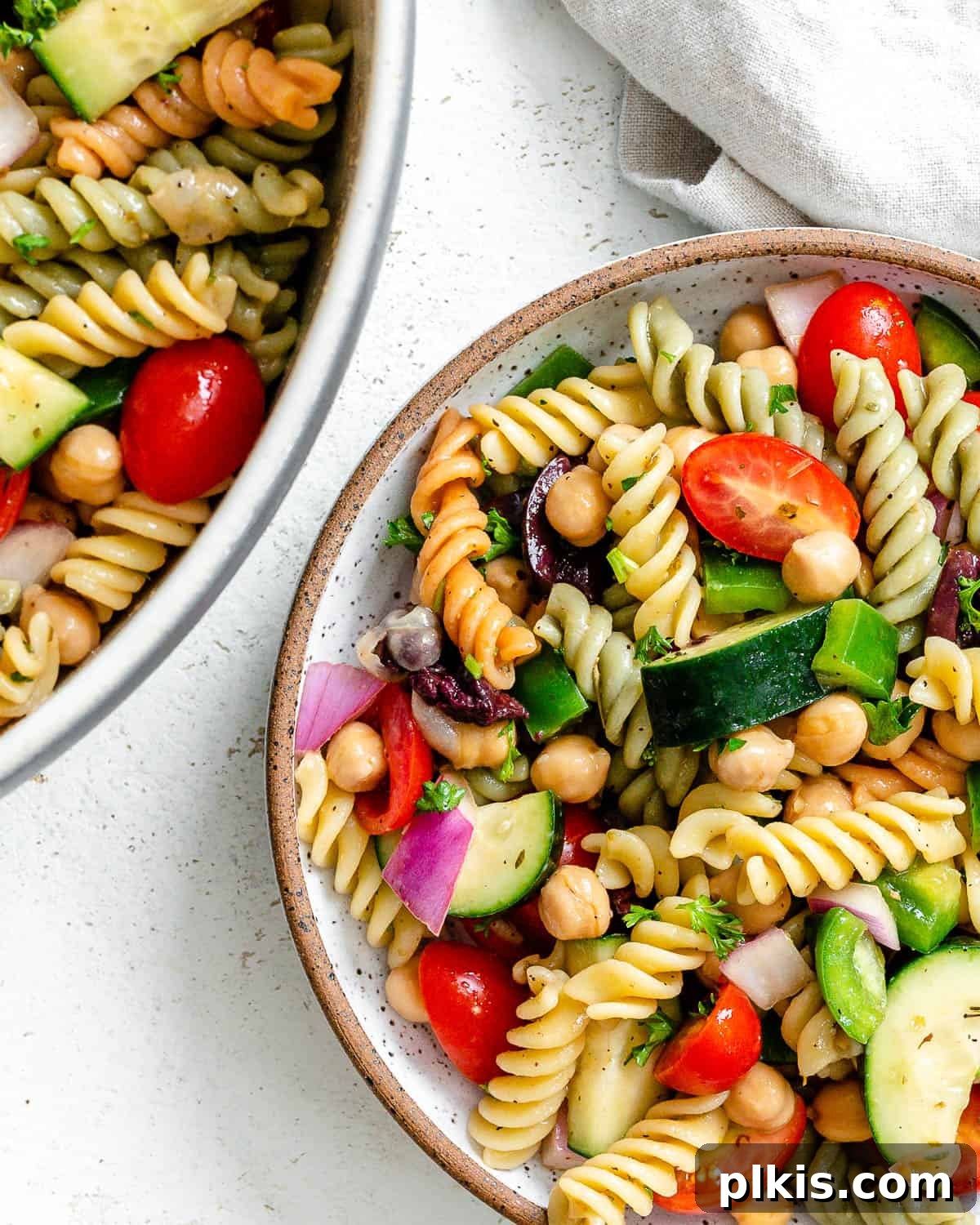 A final close-up of the Mediterranean Vegan Pasta Salad, beautifully presented in a bowl, highlighting its fresh textures and vibrant colors.