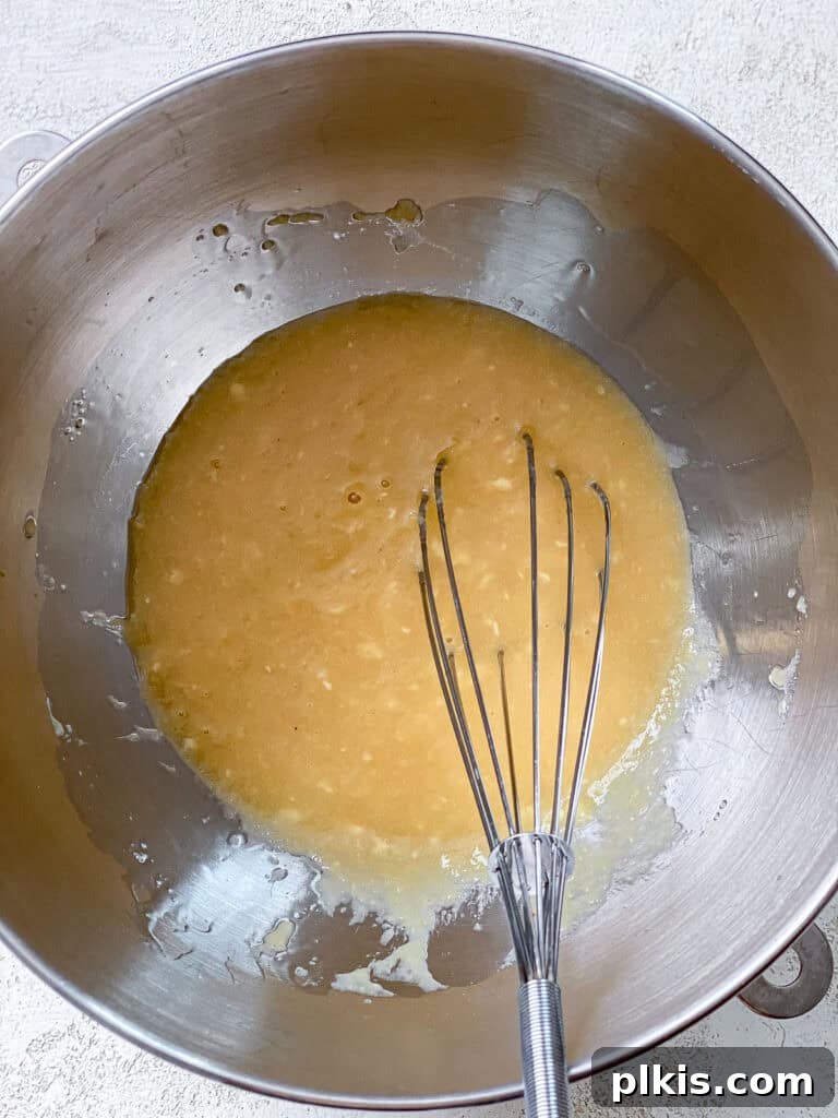 Bursting Blueberry Peach Delights 4 process shot of whisking ingredients in a bowl