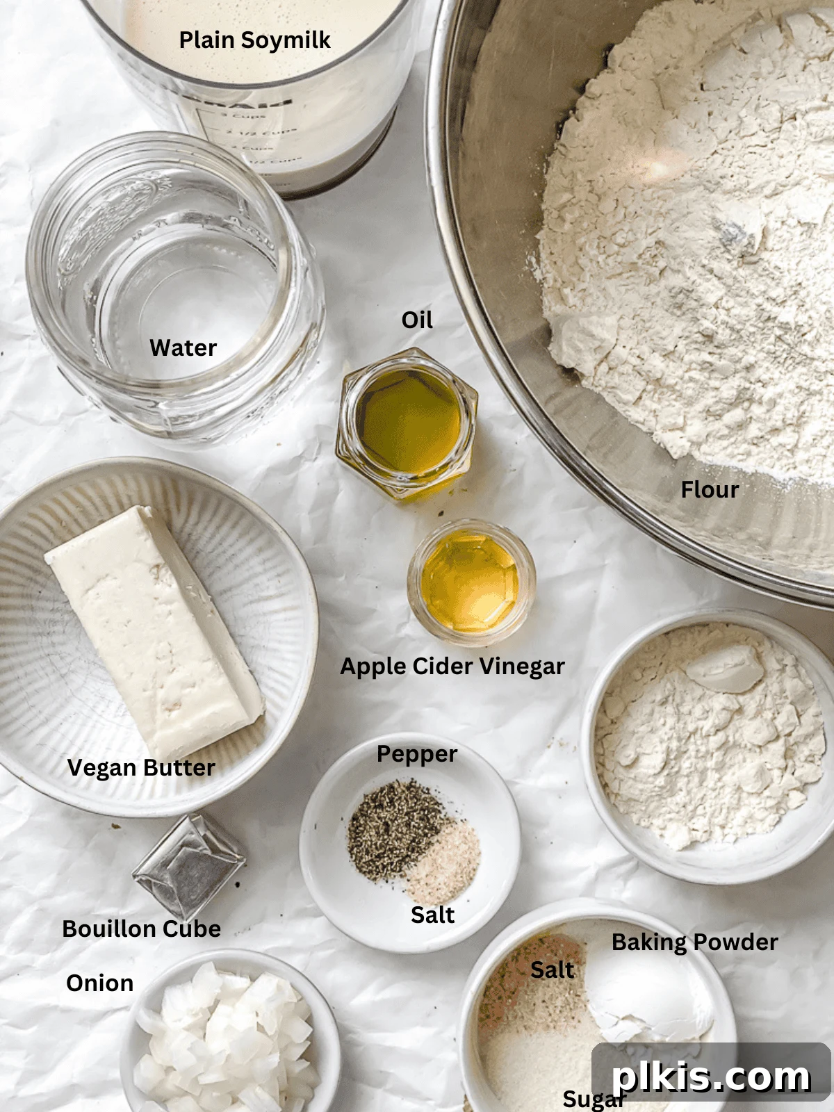 Southern Comfort Reimagined Vegan 3 A selection of ingredients laid out on a white surface, ready for making Vegan Biscuits and Gravy.