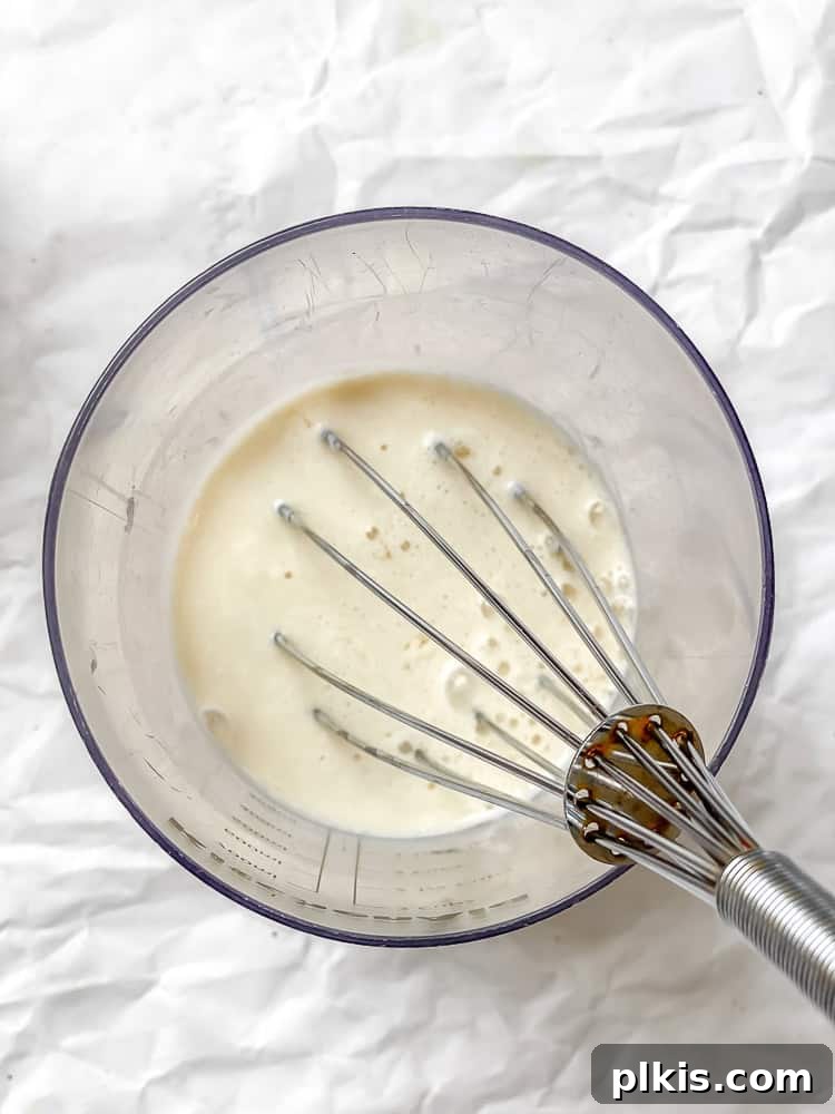 Southern Comfort Reimagined Vegan 4 Process shot showing mixing dry ingredients in a bowl.
