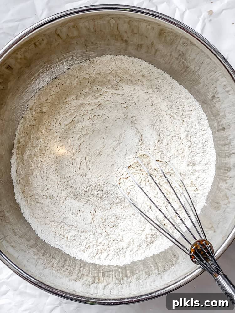Southern Comfort Reimagined Vegan 5 Process shot showing whisking soy milk and vinegar for vegan buttermilk.