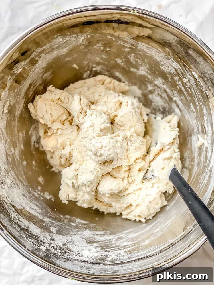 Southern Comfort Reimagined Vegan 7 Process shot showing mixing the vegan buttermilk into the flour and butter mixture.