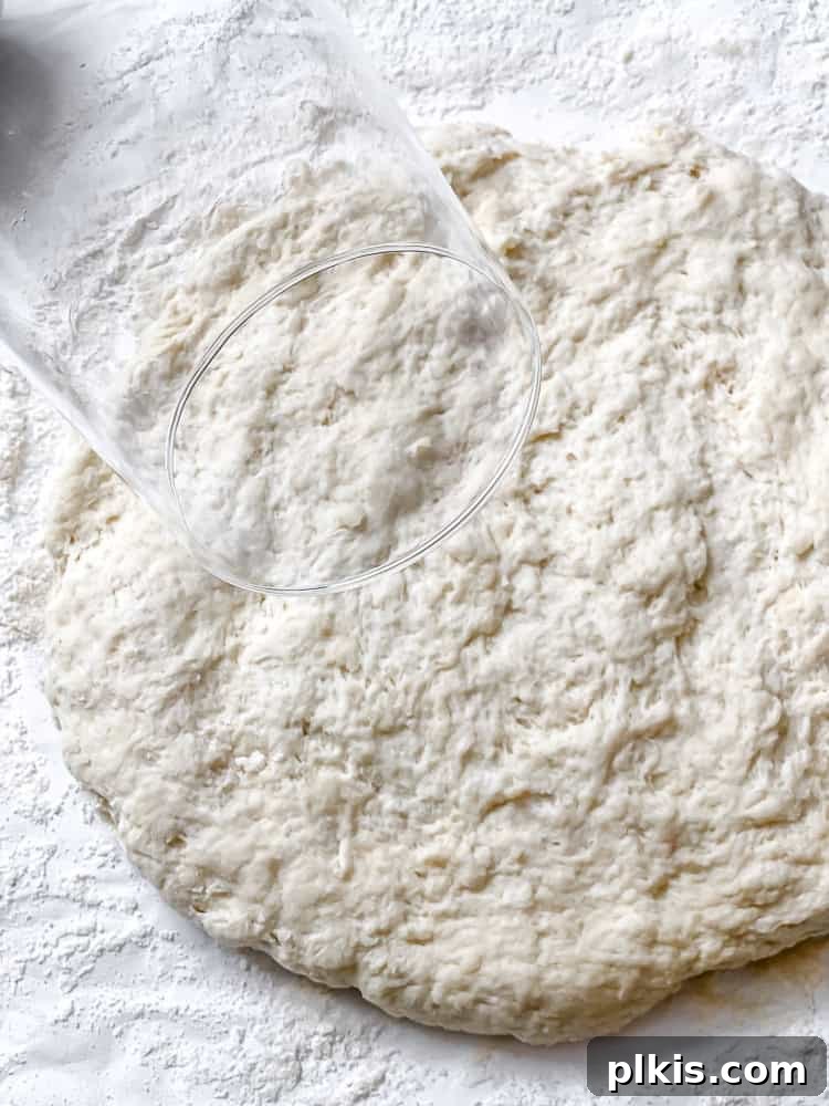 Southern Comfort Reimagined Vegan 8 Process shot showing the shaggy biscuit dough on a floured surface.