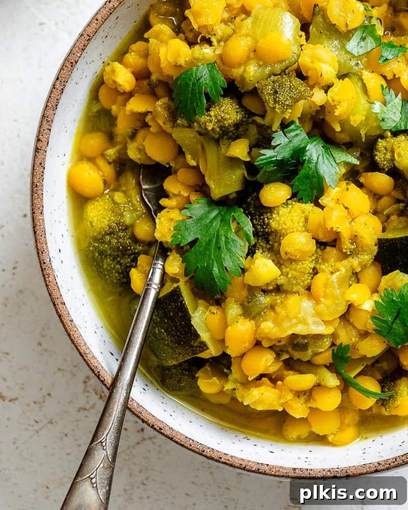 Golden Turmeric Veggie Split Pea Stew 13 A close-up shot of the completed Veggie Turmeric Yellow Split Peas dish in a serving bowl, ready to be enjoyed.