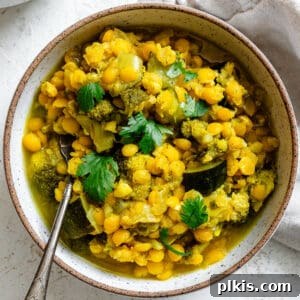 A completed dish of Veggie Turmeric Yellow Split Peas, garnished and ready to serve.