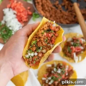 Impossible Tacos: a close-up of delicious plant-based tacos on a vibrant plate.