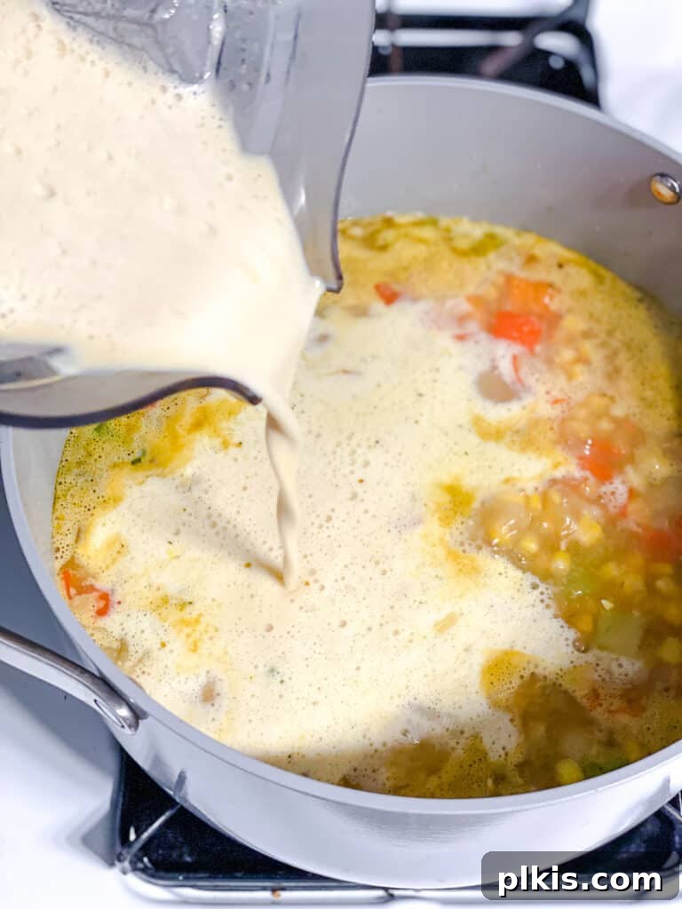 Golden Harvest Chowder 11 process shot of adding blended mixture to po
