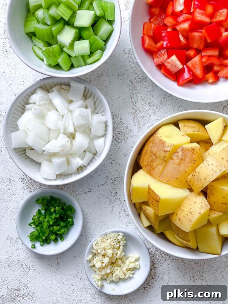 Golden Harvest Chowder 4 ingredients for Corn Chowder against a white surface