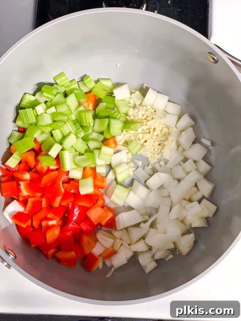 Golden Harvest Chowder 5 process shot showing addition of veggies in pot