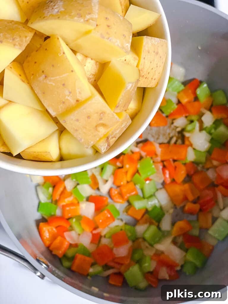 Golden Harvest Chowder 6 process shot of adding potatoes to pot