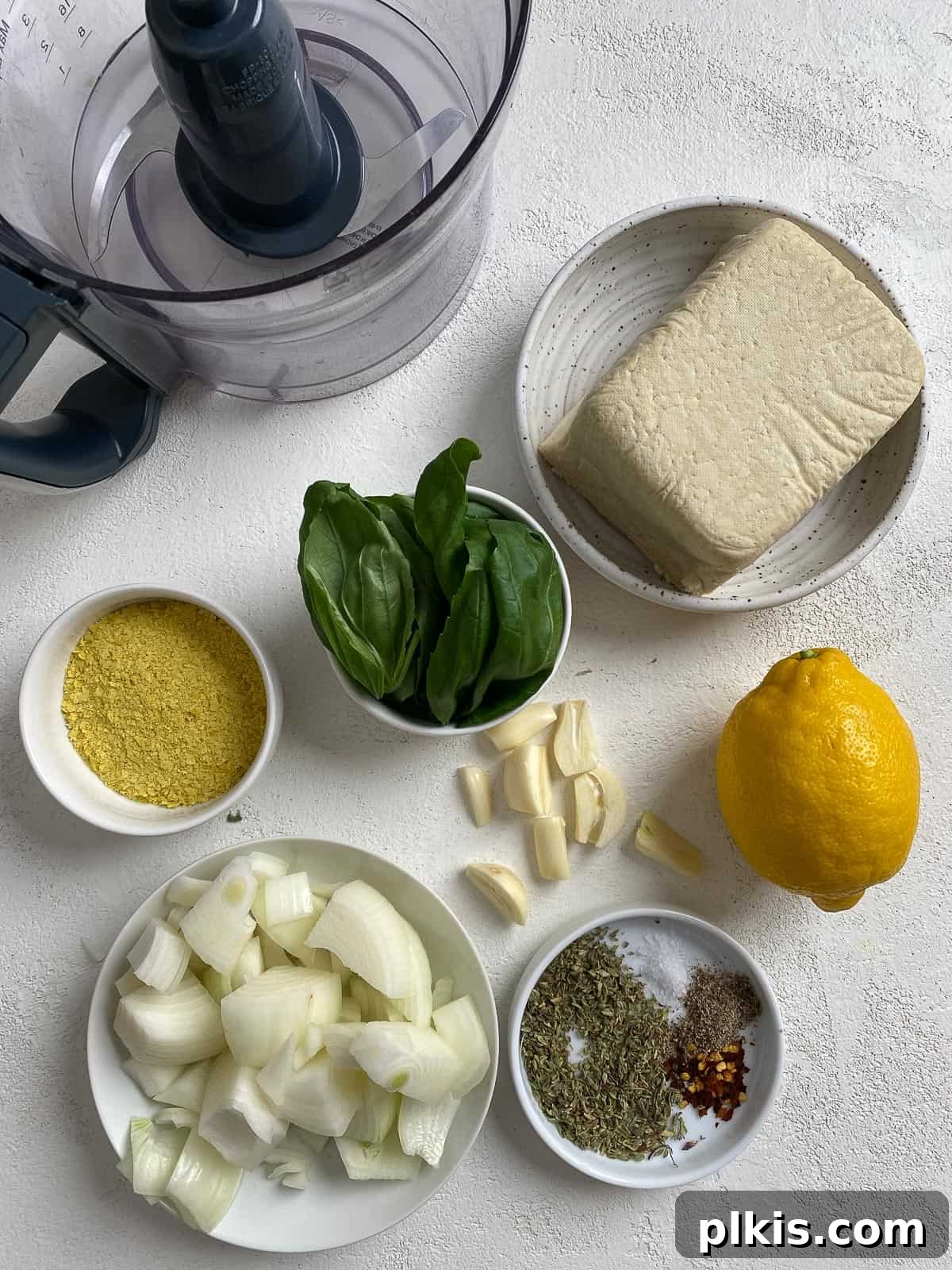 Creamy Vegan Stuffed Shells 5 All the vegan stuffed shells ingredients laid out on a white kitchen counter, prepped for assembly.