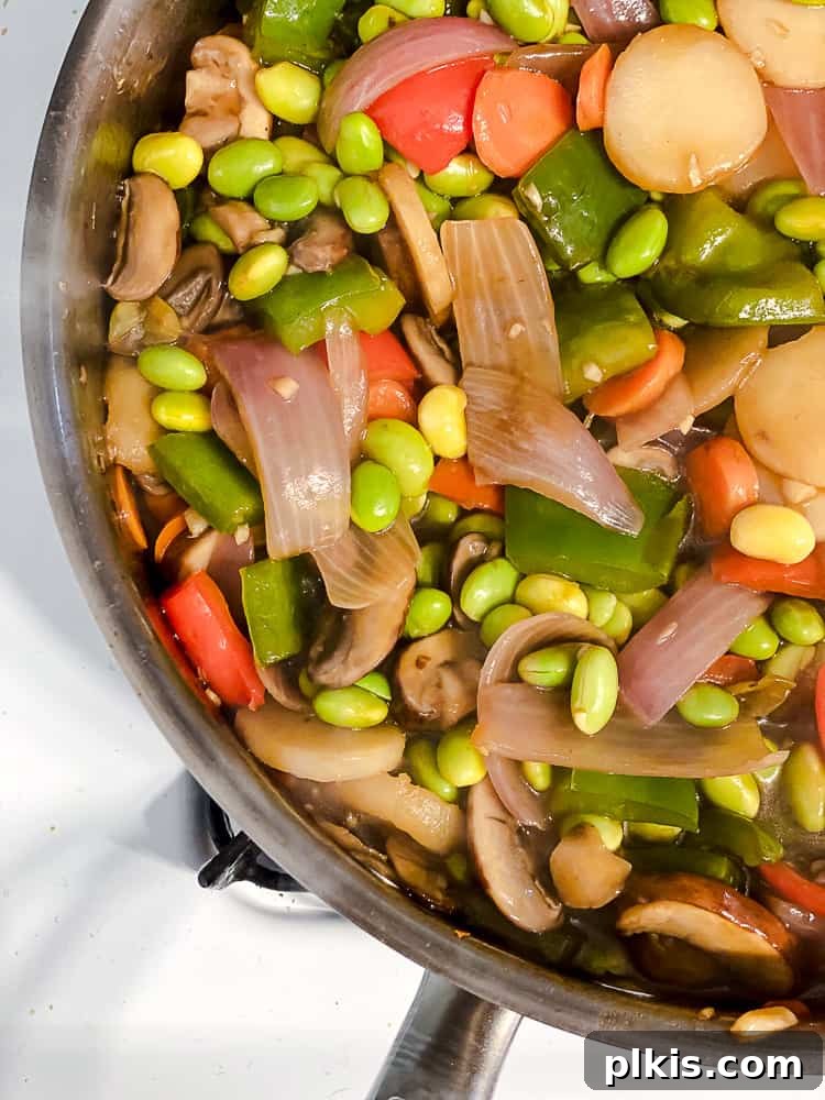 Edamame Vegetable Flash Fry 6 process shot of veggies cooking in a pan