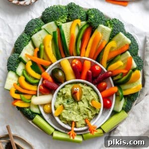 Effortless Holiday Veggie Platter 9 Completed Easy Turkey Veggie Tray on white surface.