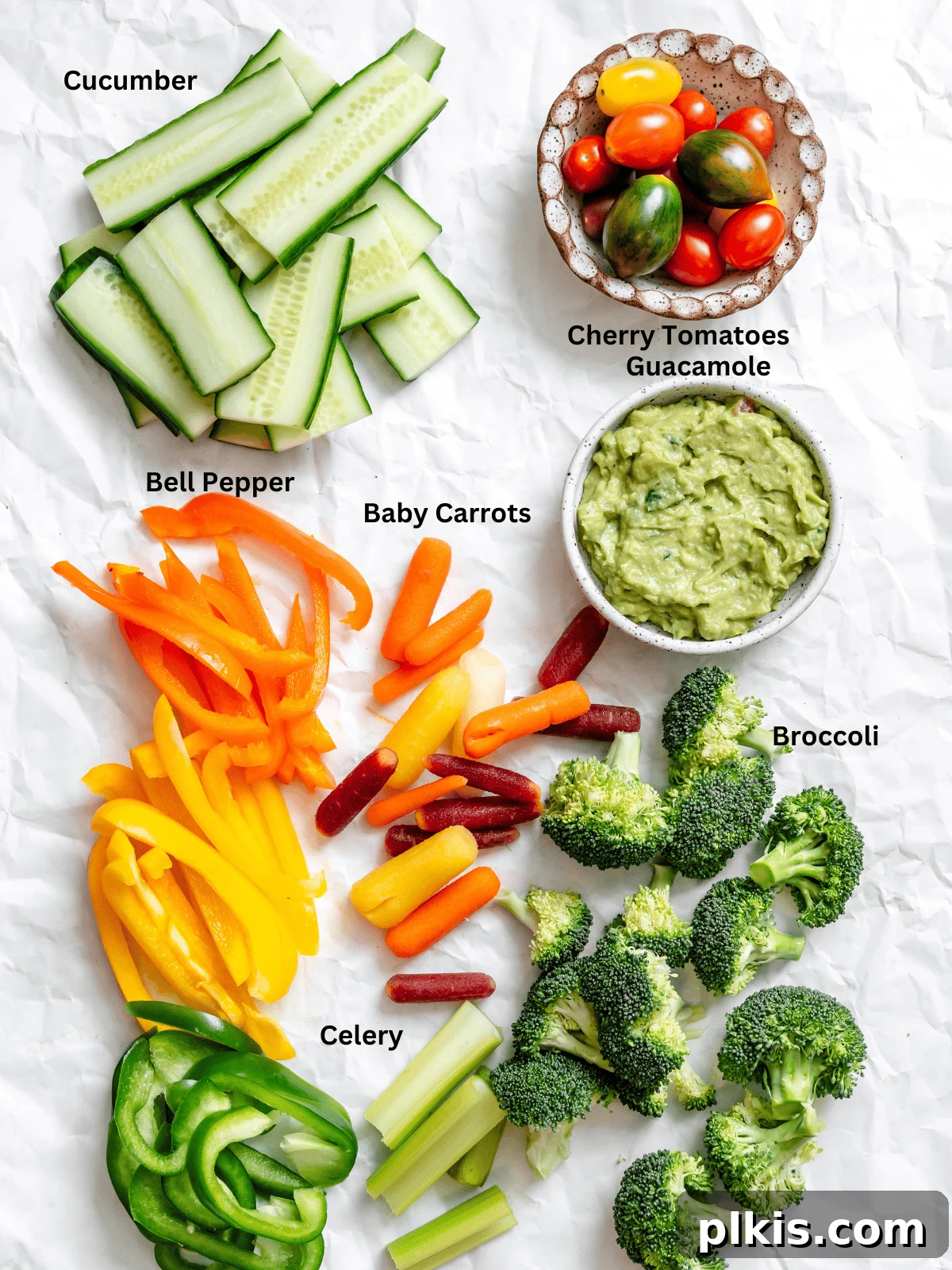Effortless Holiday Veggie Platter 3 Ingredients for Easy Turkey Veggie Tray measured out on a white surface, showcasing fresh vegetables.
