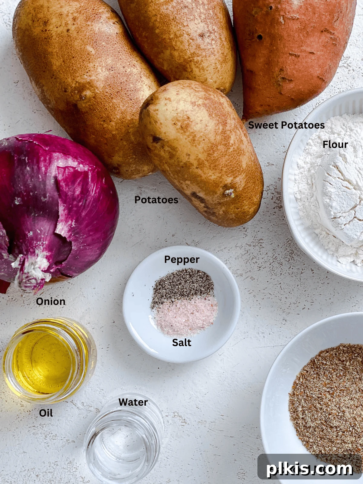 Golden Sweet Potato Latkes 3 Ingredients for Sweet Potato Latkes arranged on a white surface