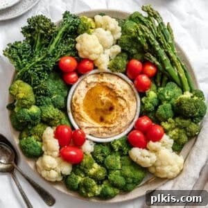 Completed Christmas Veggie Tray, arranged beautifully on a white platter, suitable as a tree or wreath.