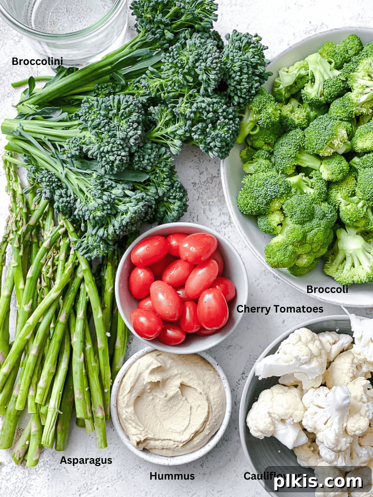 Christmas Tree Veggie Tray 3 Fresh vegetables and dips laid out as ingredients for a Christmas Veggie Tray.