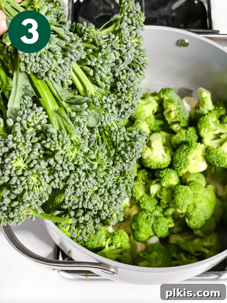 Christmas Tree Veggie Tray 6 Step-by-step image of adding broccolini to a pot for steaming.