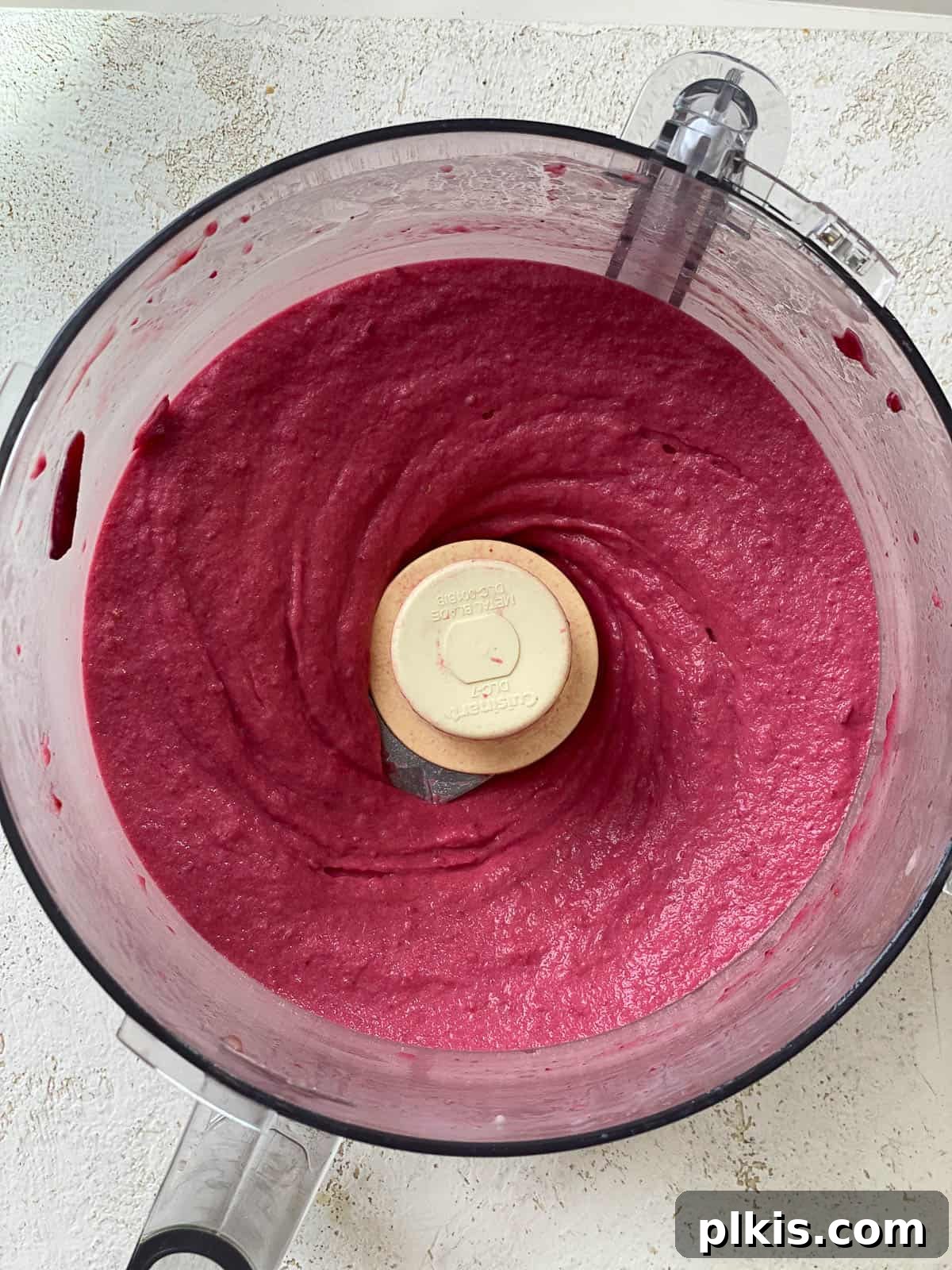 Ruby Red Refresher 5 process shot showing Quick Fruit and Beet Smoothie in food processor