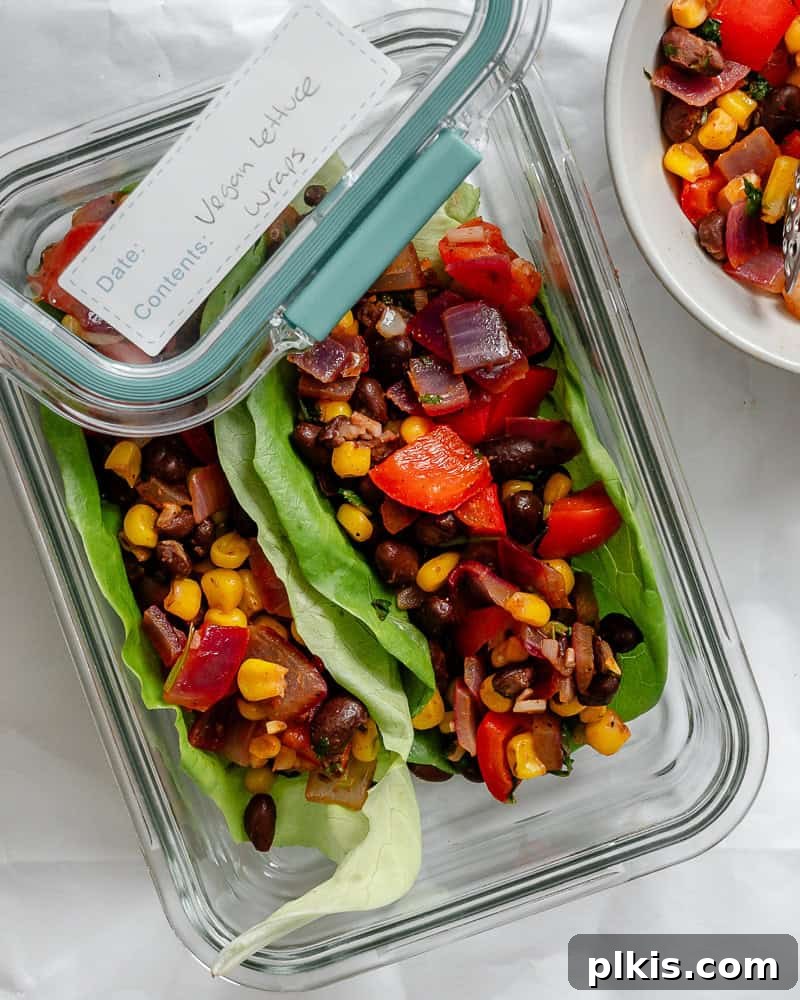 Zesty Bean and Corn Lettuce Wraps 8 A container of Vegetarian Lettuce Wraps (Beans & Corn) filling, neatly stored, demonstrating meal prep convenience.