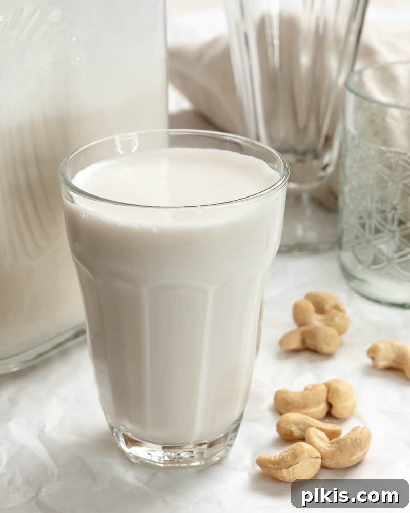 Whip Up Your Own Cashew Milk 12 completed Cashew Milk in a glass and a jug, ready to serve