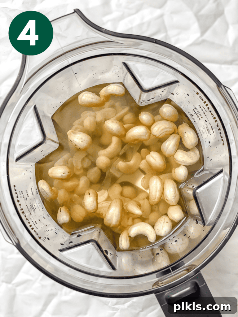 Whip Up Your Own Cashew Milk 7 process shot showing cashews being blended in a high-speed blender
