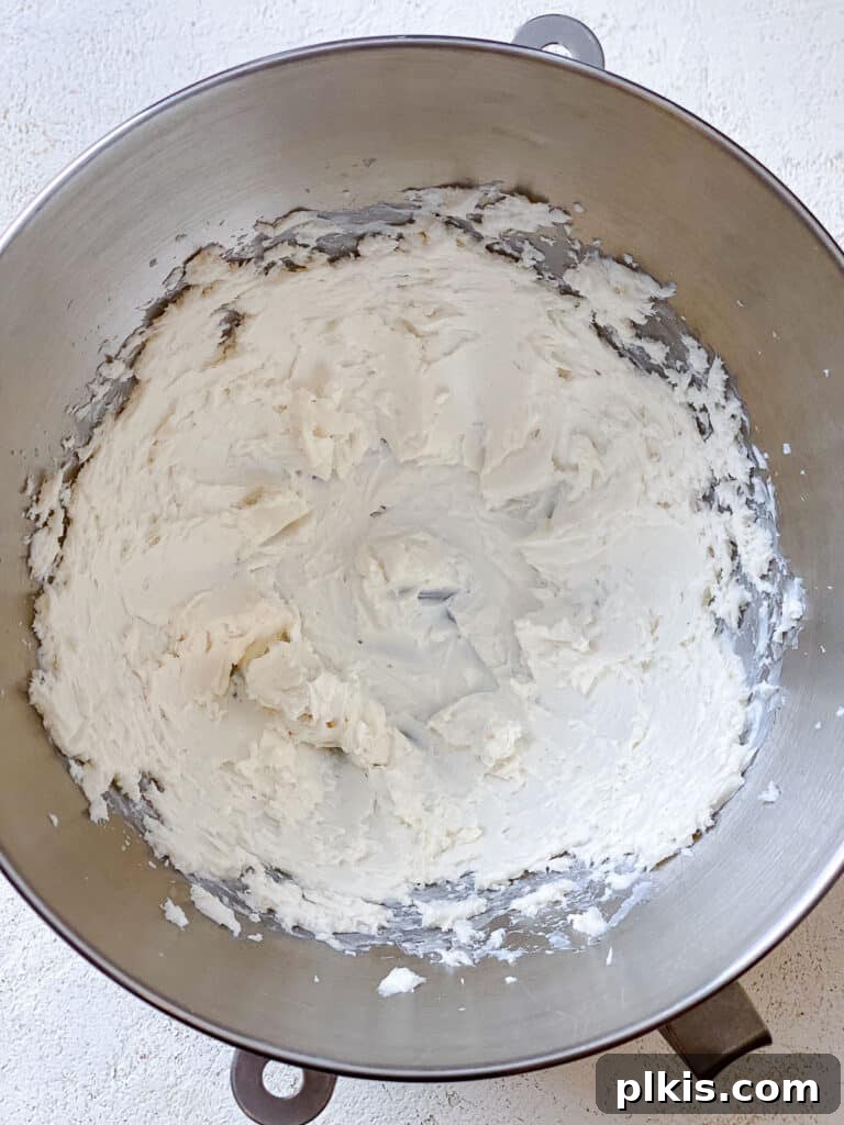 Velvety Vegan Vanilla Buttercream 4 Process shot showing softened vegan butter being creamed in a stand mixer bowl.
