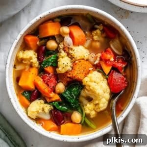 completed Kale Vegetable Bean Soup on a white surface