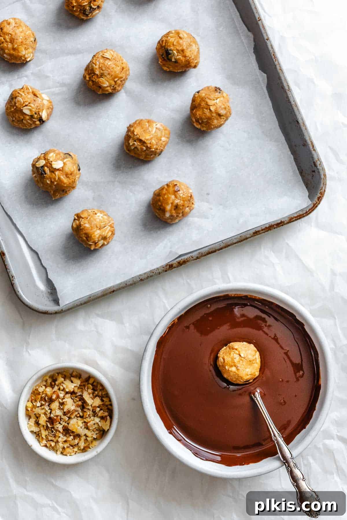 Loaded Chocolate Peanut Butter Truffles 6 Process shot showing dipping ball into vegan chocolate.