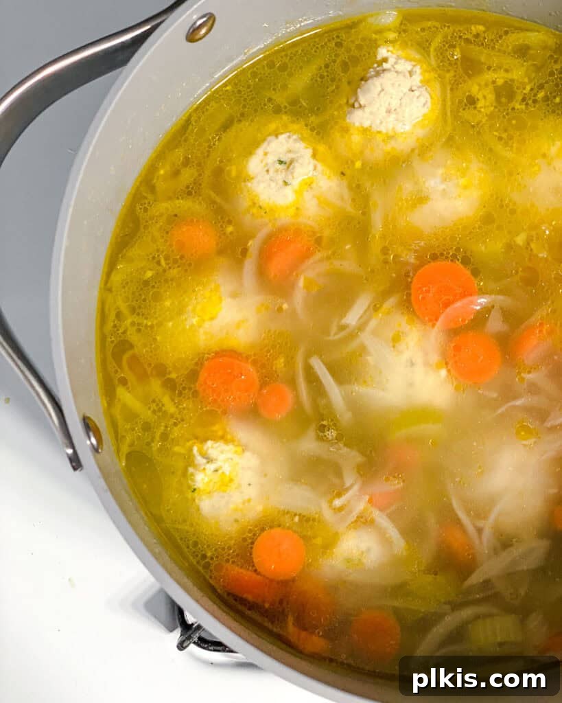 Comforting Vegan Matzo Ball Soup 16 process shot showing dough added to pot