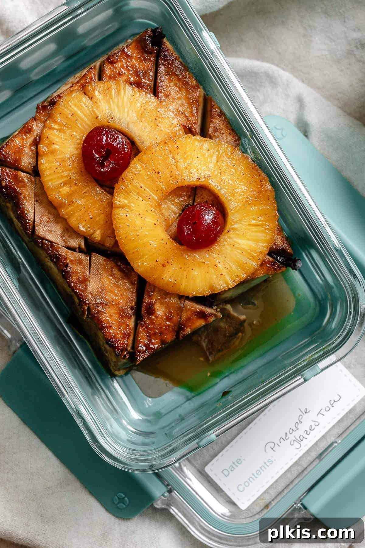 Golden Pineapple Glazed Tofu Ham 12 Leftover Pineapple Glazed Tofu Ham neatly stored in a clear, airtight container, ready for refrigeration or freezing to be enjoyed later.