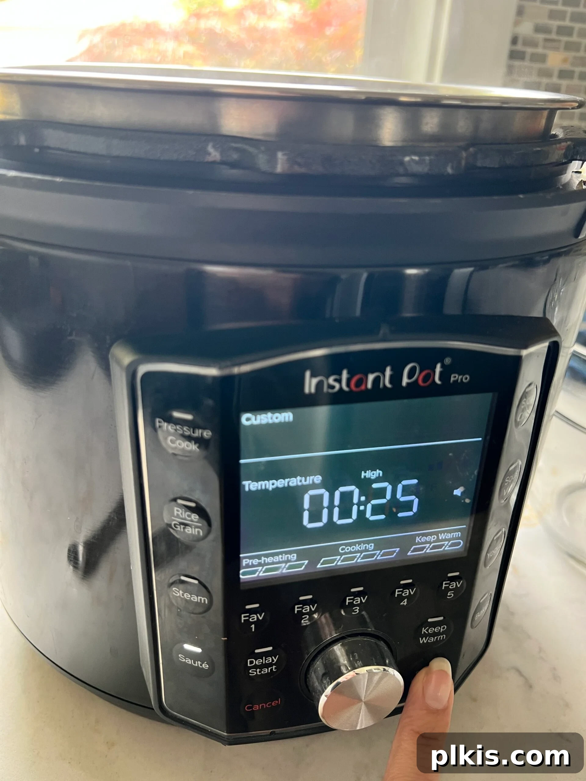 Perfectly Cooked Instant Pot Pinto Beans 11 process shot of adjusting settings on instant pot