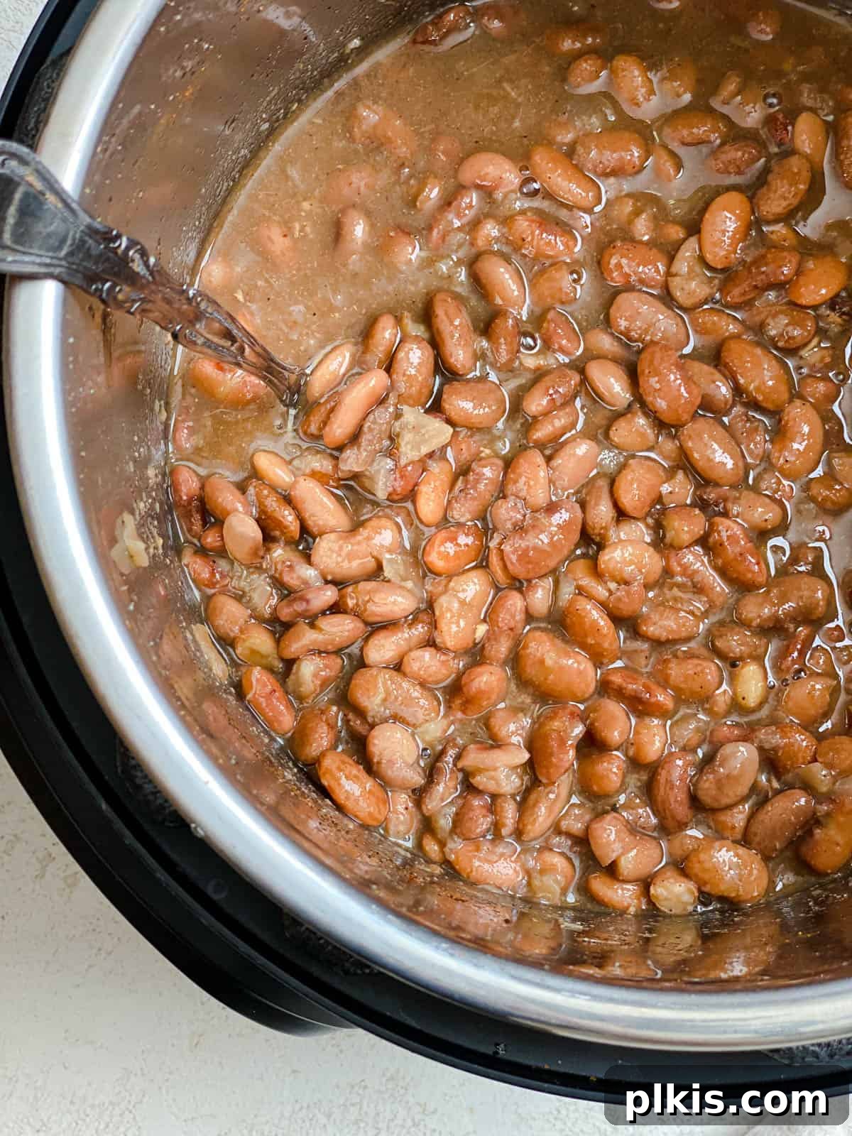 Perfectly Cooked Instant Pot Pinto Beans 12 process shot of stirring ingredients in Instant Pot Pinto Beans