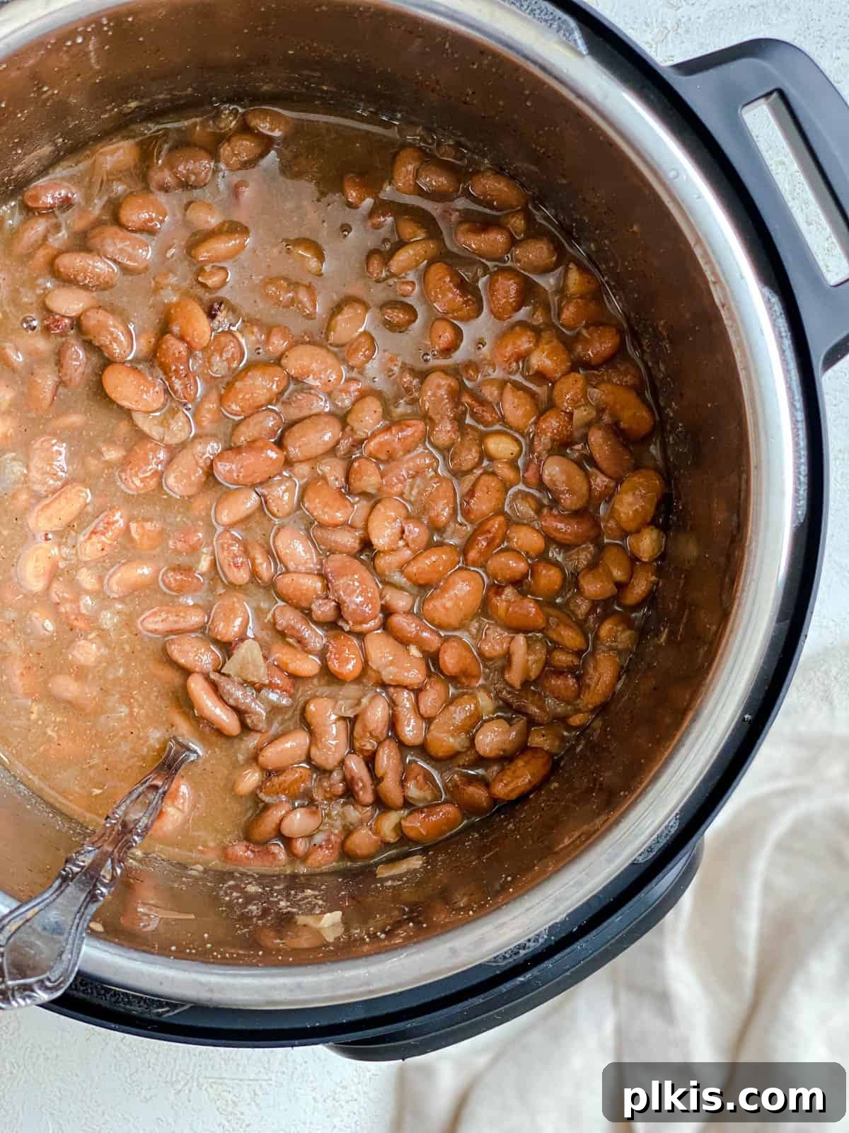 Perfectly Cooked Instant Pot Pinto Beans 13 process shot of stirring ingredients in Instant Pot Pinto Beans