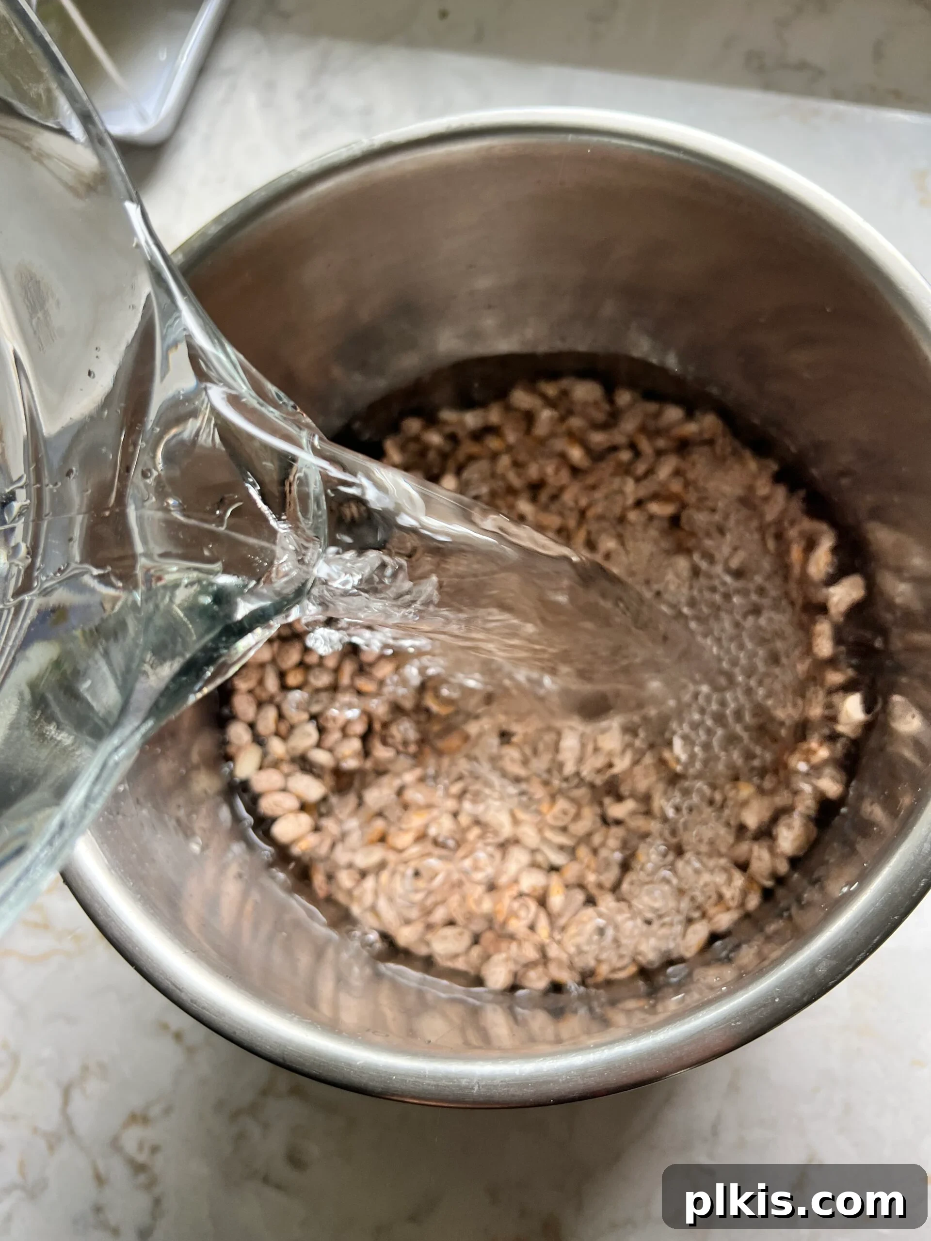 Perfectly Cooked Instant Pot Pinto Beans 5 process shot of adding water to pinto beans in instant pot bowl