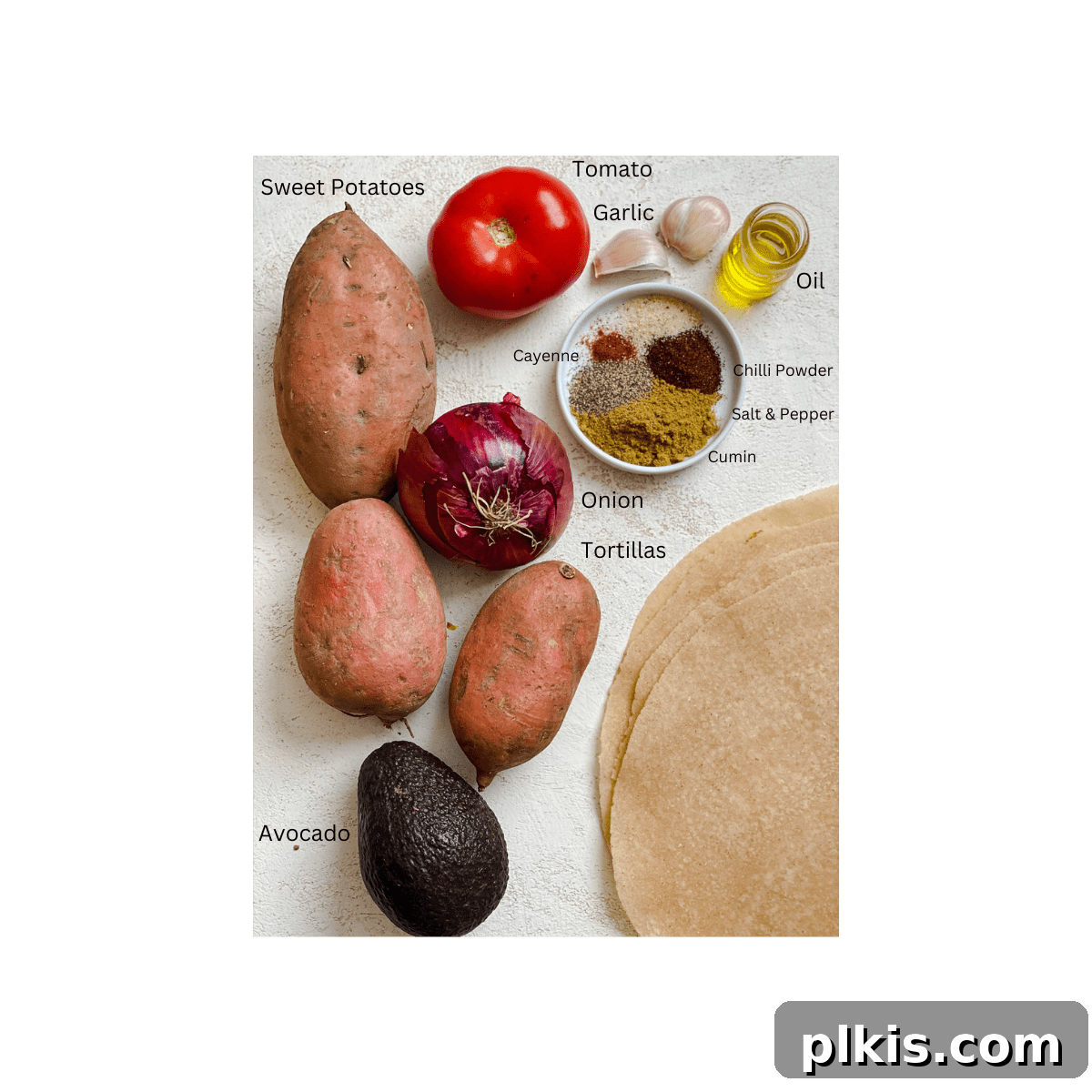 Roasted Sweet Potato and Black Bean Burritos 3 ingredients for Sweet Potato Burritos measured out against a white surface