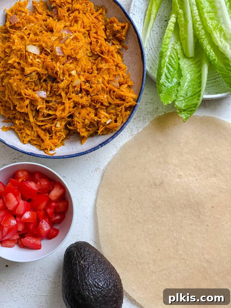 Roasted Sweet Potato and Black Bean Burritos 10 ingredients for Sweet Potato Burritos measured out against a white surface