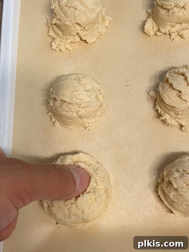 Ruby Raspberry Thumbprint Delights 13 process shot of creating divot in dough
