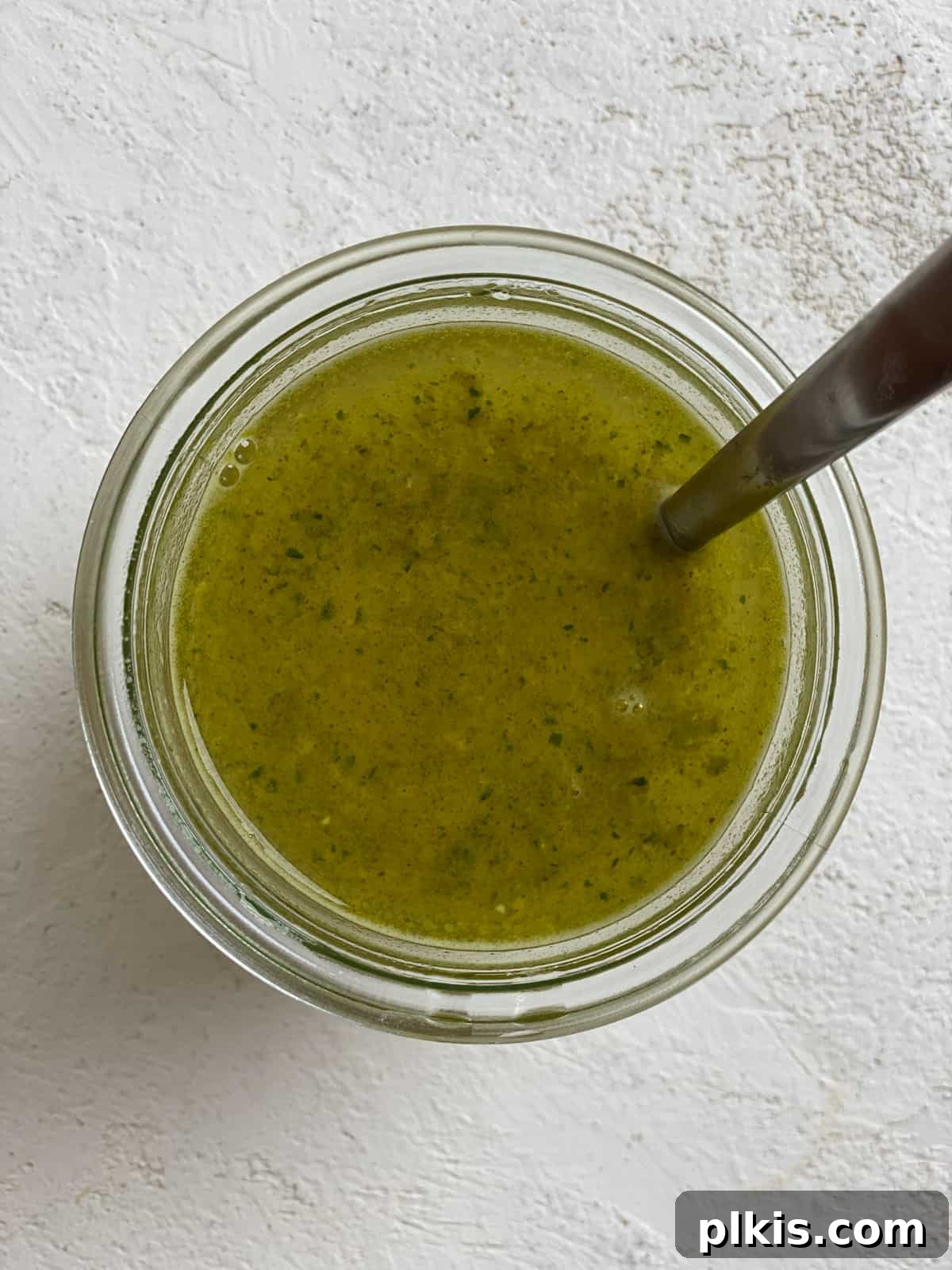 Effortless Plant-Based Gravy 4 The process of dissolving a bouillon cube in hot water to create a vegetable broth for gravy.